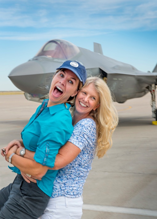 At ease: Photographer Karen Shell and Art Director Karen Holub celebrate a successful photo shoot in front of the F-35A Lightning II, July 9, 2015.